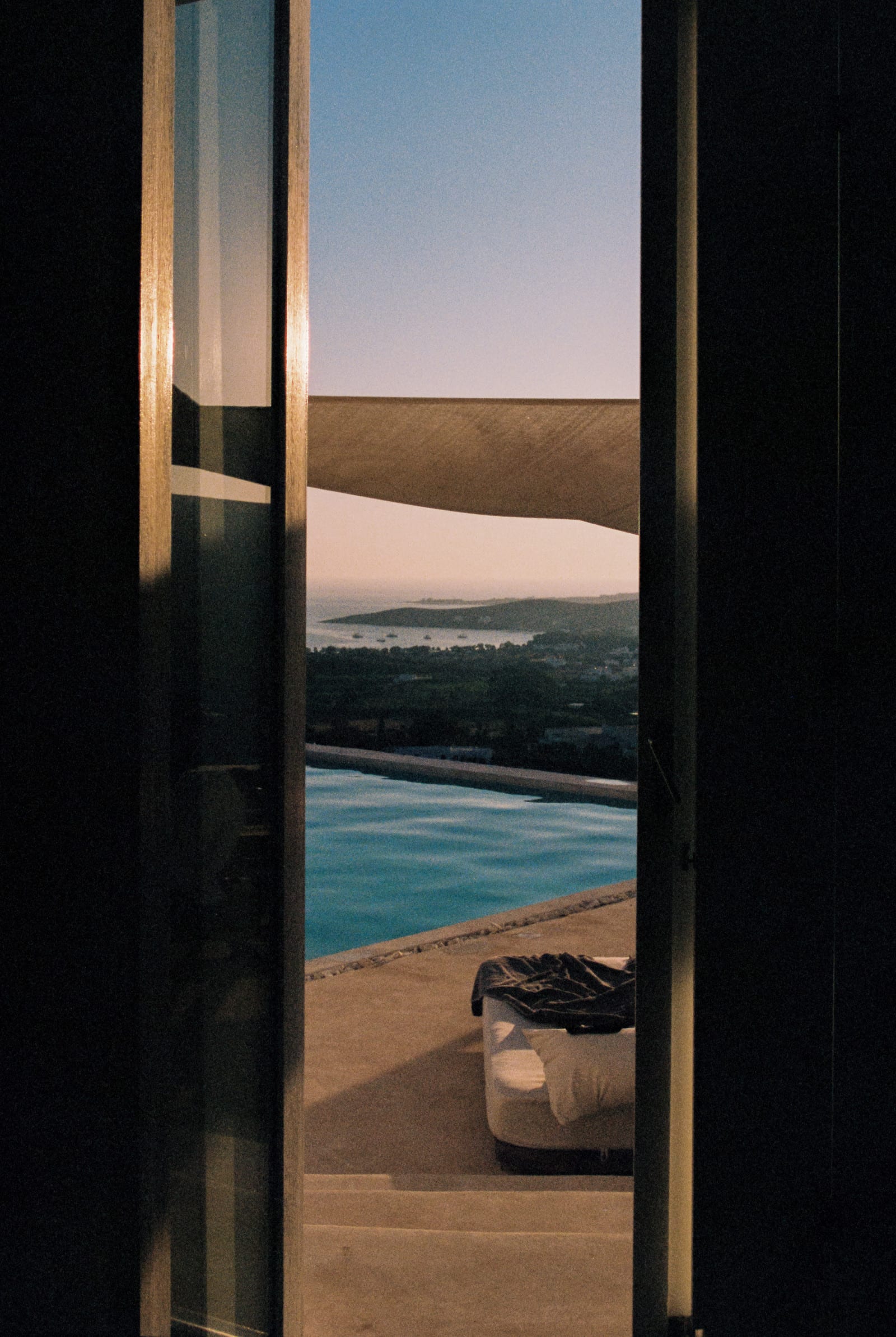Sea view from a hotel window at dusk